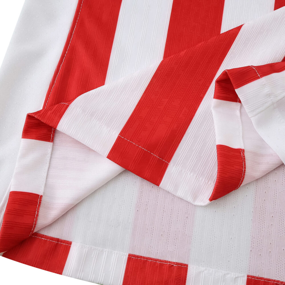 Close-up of Atlético Madrid 2025/26 Home Player Version jersey fabric with red and white stripes.