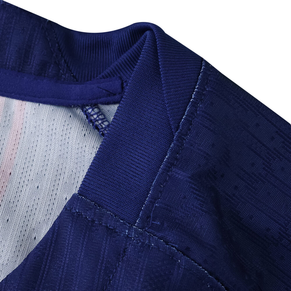 Close-up of the collar and shoulder stitching on the Barcelona Home 2025/26 Player Version jersey.