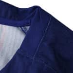Close-up of the collar and shoulder stitching on the Barcelona Home 2025/26 Player Version jersey.