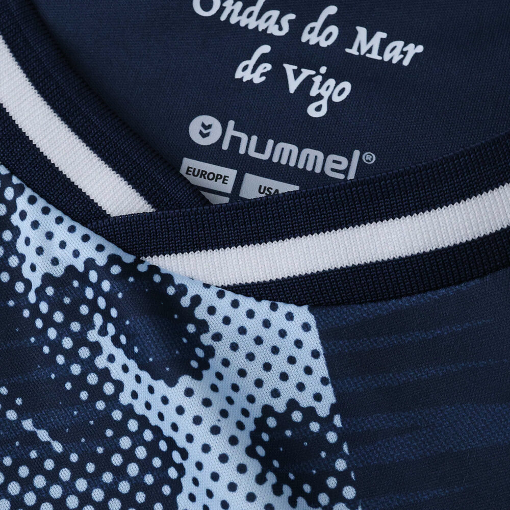Close-up of Celta Vigo Away 2025/26 Fan Version jersey collar with Hummel branding and printed design.