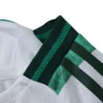 Close-up of the Celtic Home 2025/26 Player Version jersey collar with green and white details.
