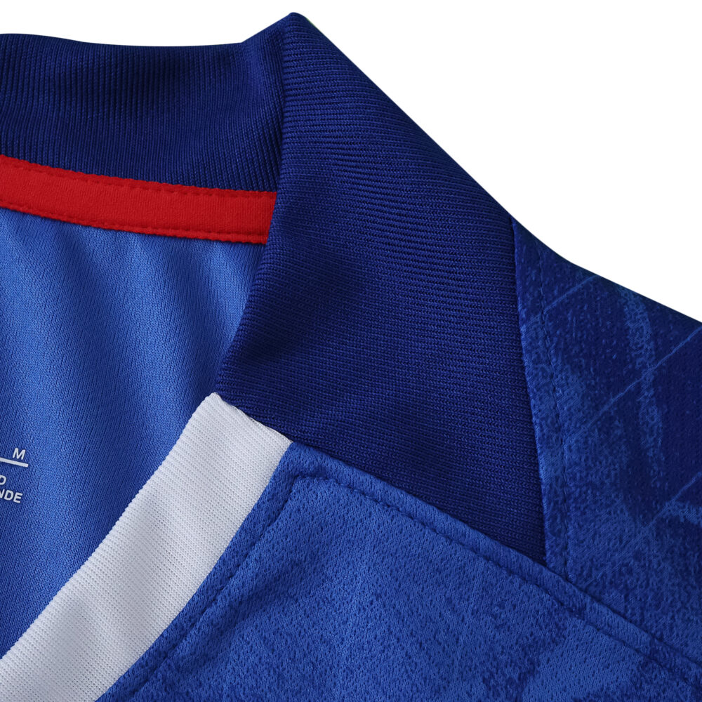 Close-up of the Chelsea Home 2025/26 Fan Version jersey collar in blue with red and white accents.