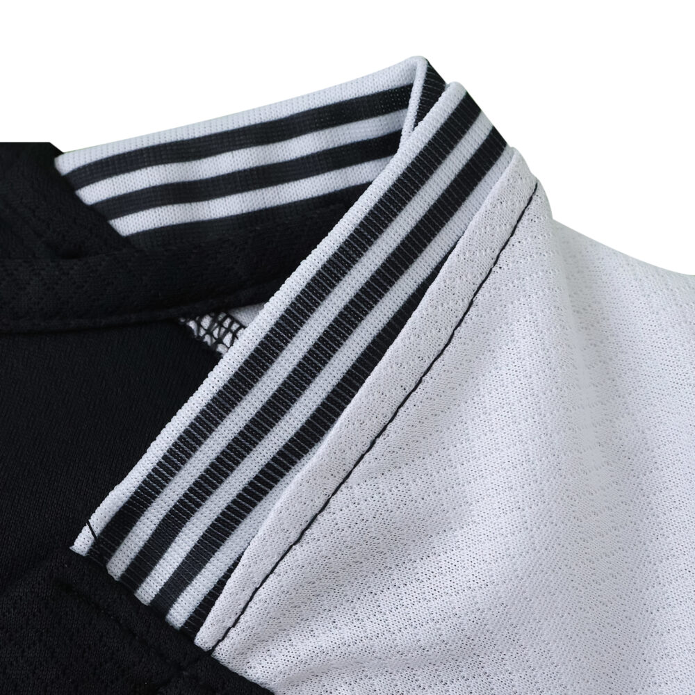 Close-up of the collar on the Corinthians Away 2025/26 Fan Version jersey, featuring black and white stripes.
