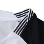 Close-up of the Corinthians 2025/26 home fan jersey collar with black and white stripes.