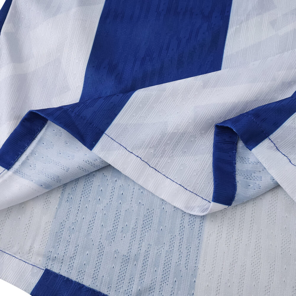 Close-up of FC Porto 2025/26 Home Player Version jersey fabric with blue and white stripes.