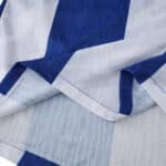 Close-up of FC Porto 2025/26 Home Player Version jersey fabric with blue and white stripes.