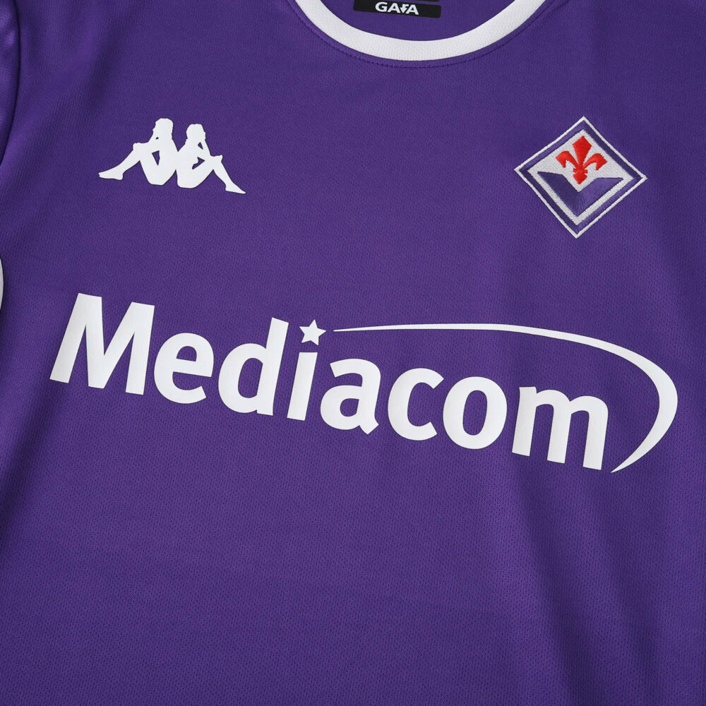Fiorentina 2025/26 home fan jersey with Kappa logo, club crest, and Mediacom sponsor on purple fabric.