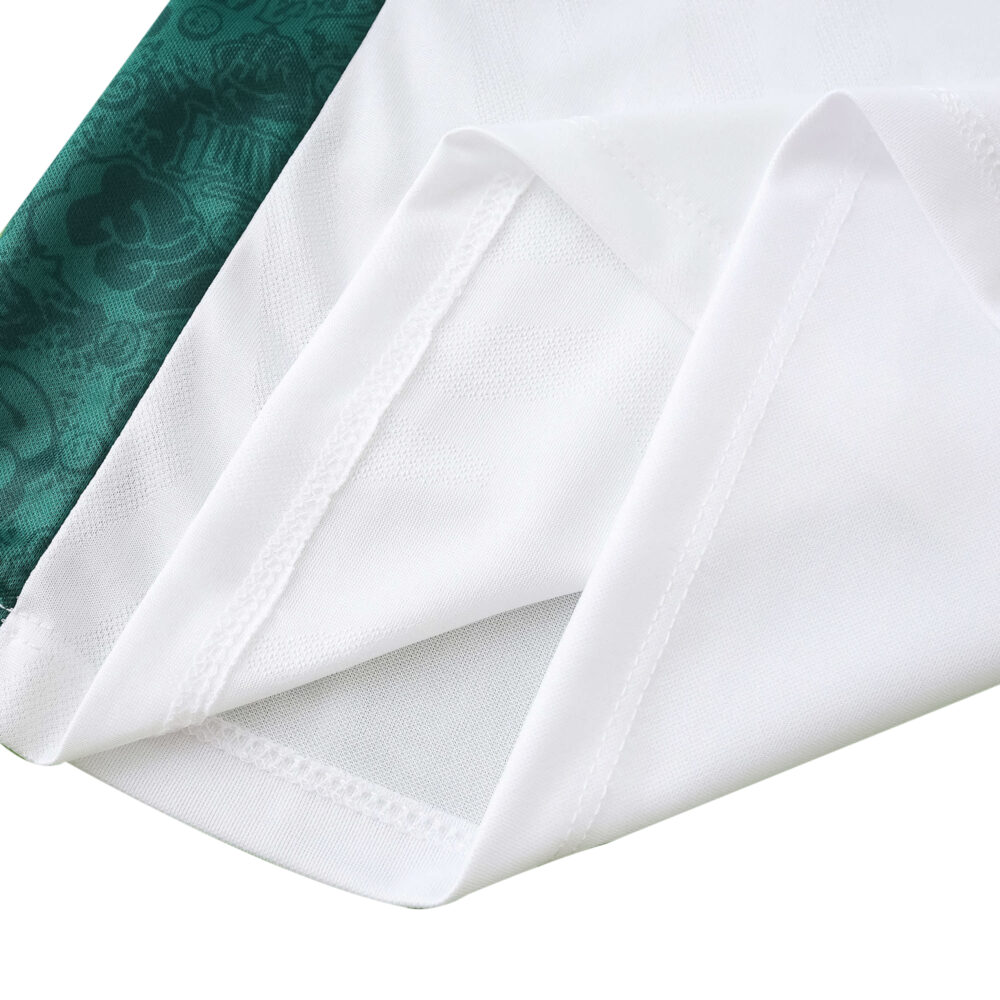 Close-up of Fluminense Away 2025/26 Fan Version jersey fabric, showing white mesh texture and green trim.