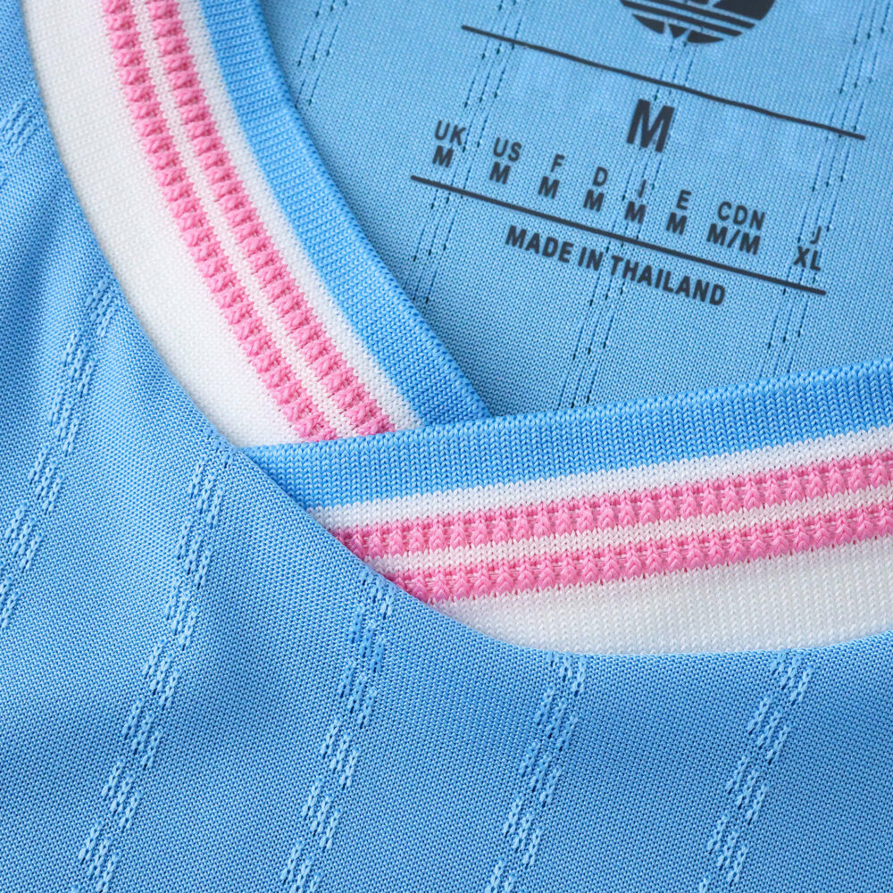 Close-up of Inter Miami CF 2025/26 Third Player Version jersey collar in light blue with pink and white stripes.