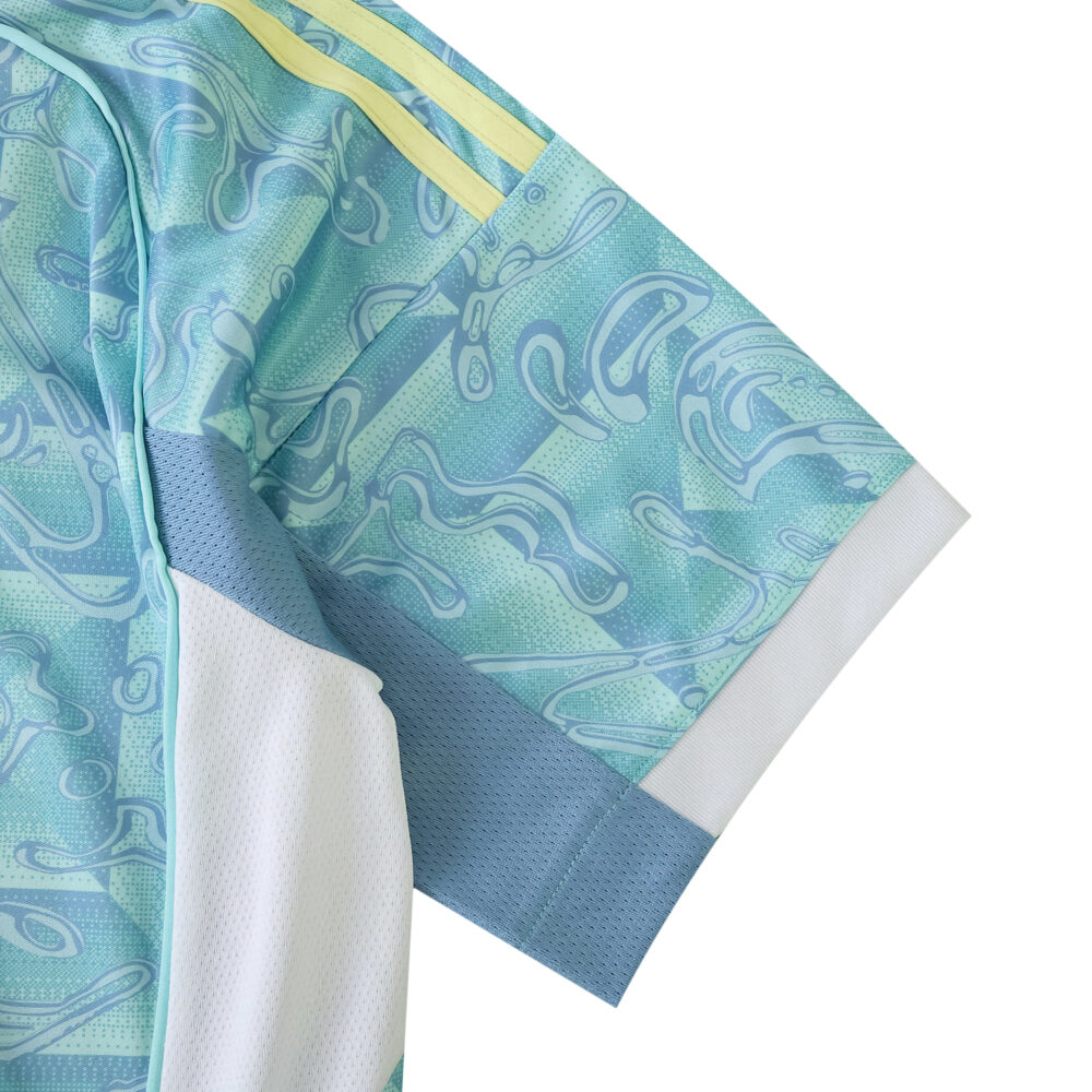 Close-up of the Juventus Away 2025/26 Fan Version jersey sleeve with blue pattern and yellow accents.