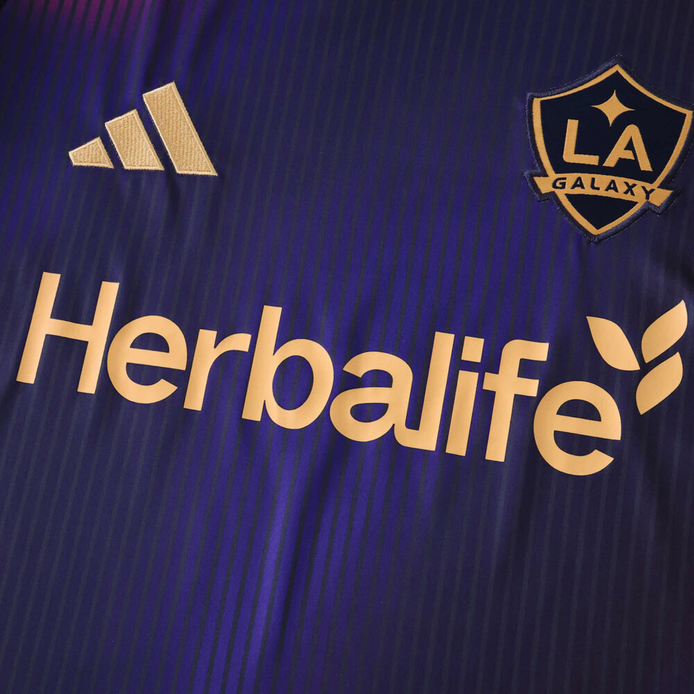 Close-up of LA Galaxy Away 2025/26 fan jersey showing club badge, adidas logo, and Herbalife sponsor.