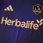 Close-up of LA Galaxy Away 2025/26 fan jersey showing club badge, adidas logo, and Herbalife sponsor.