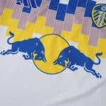 Close-up of the 2025/26 Leeds United Home Fan Version jersey featuring club crest and sponsor logo.