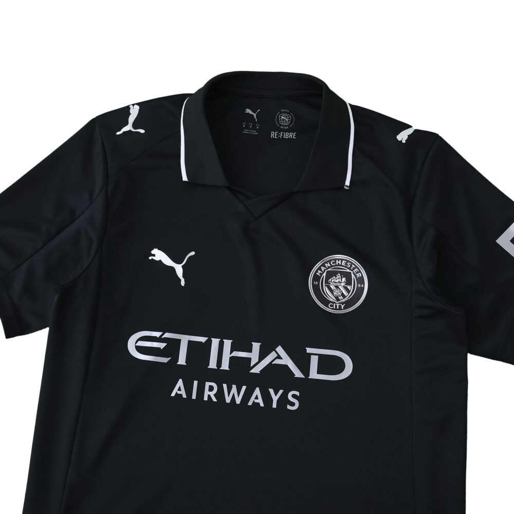 Manchester City Away 2025/26 Fan Version jersey in black with white details and sponsor logos.
