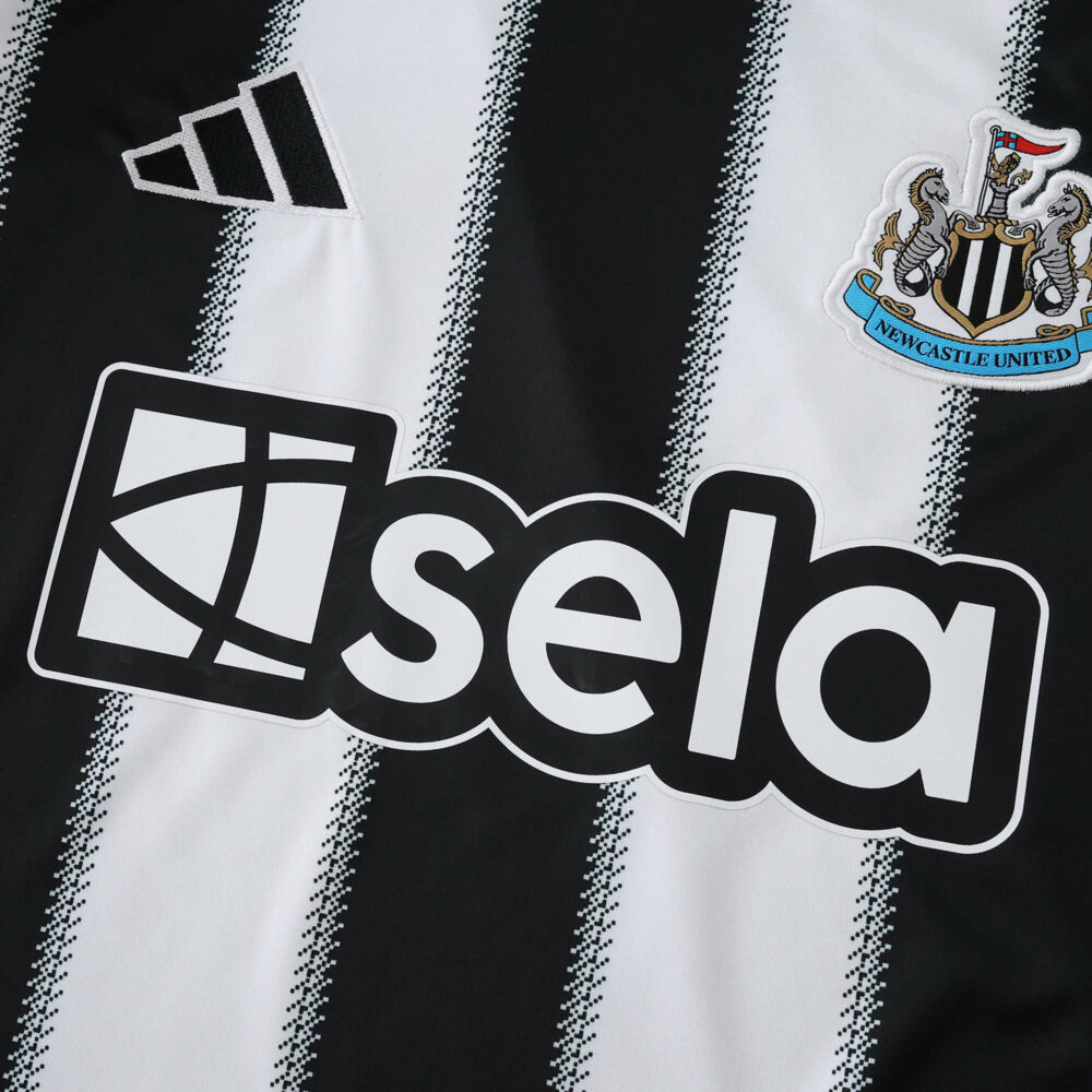 Close-up of the Newcastle United 2025/26 home fan jersey with club crest and sponsor logo.