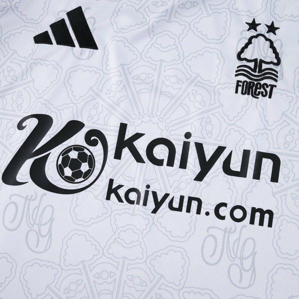 Nottingham Forest 2025/26 away fan jersey, white with black sponsor logos and club crest details.