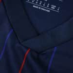 Close-up of Olympique Lyonnais Away 2025/26 Fan Version jersey collar and fabric detail.