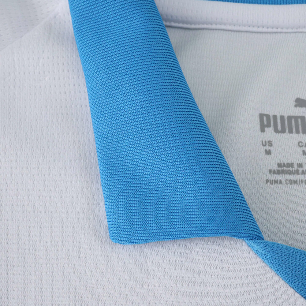 Close-up of the Olympique Marseille 2025/26 home fan jersey collar in white and light blue.