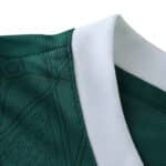 Close-up of Palmeiras 2025/26 home jersey collar, featuring green fabric with a white ribbed neckline.