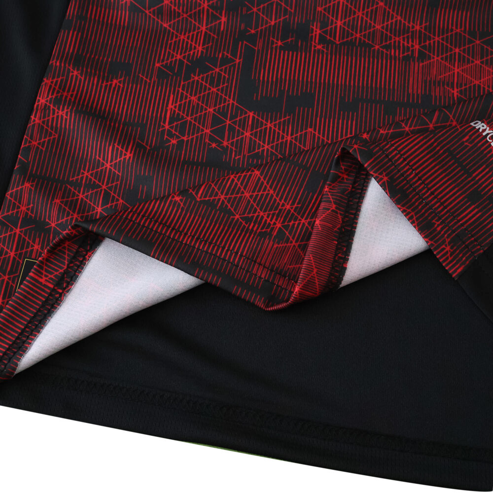Close-up of the RB Leipzig Third 2025/26 Fan Version jersey showing red geometric patterns on dark fabric.