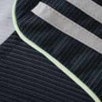 Close-up of the Real Madrid Away 2025/26 Fan Version jersey showing textured fabric and stripe details.