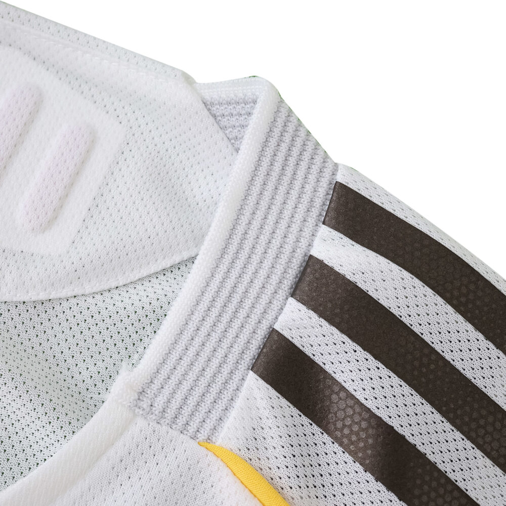 Close-up of Real Madrid 2025/26 Home Player Version jersey collar and shoulder with black stripes.