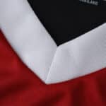 Close-up of the white V-neck collar on the River Plate Away 2025/26 Fan Version jersey.