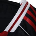 Close-up of River Plate Away 2025/26 Player Version jersey showing black fabric with red and white accents.