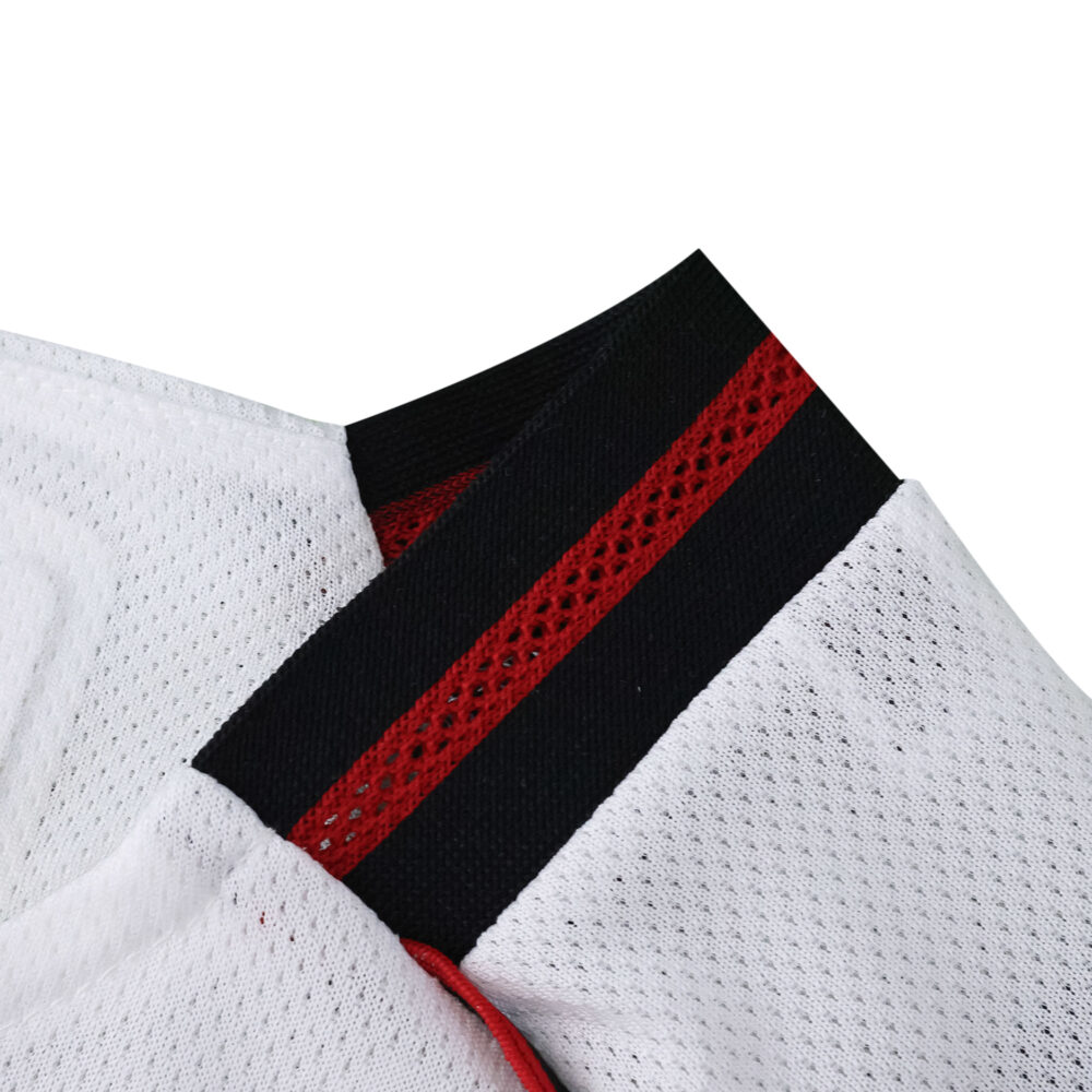 Close-up of River Plate 2025/26 Home Player Version jersey collar with black and red stripe detail.