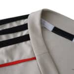 Close-up of SL Benfica Away 2025/26 Fan Version collar showing fabric texture and design details.