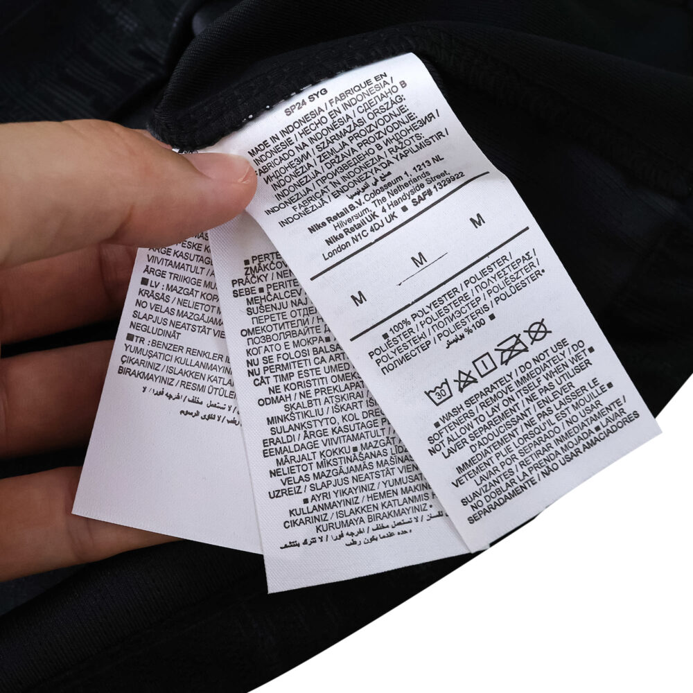 Close-up of care and size labels on the Tottenham Hotspur Away 2025/26 Player Version jersey.