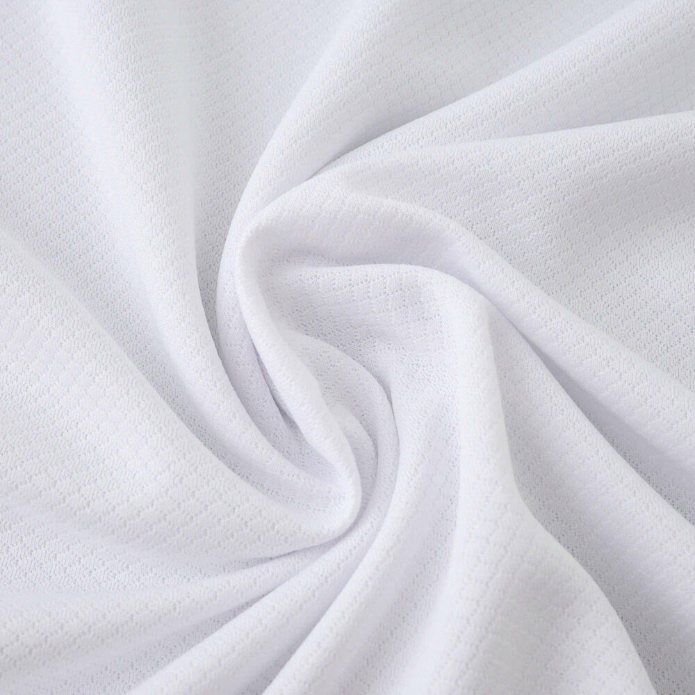 Close-up of white Tottenham Hotspur 2025/26 Home Fan Version jersey fabric with textured detail.