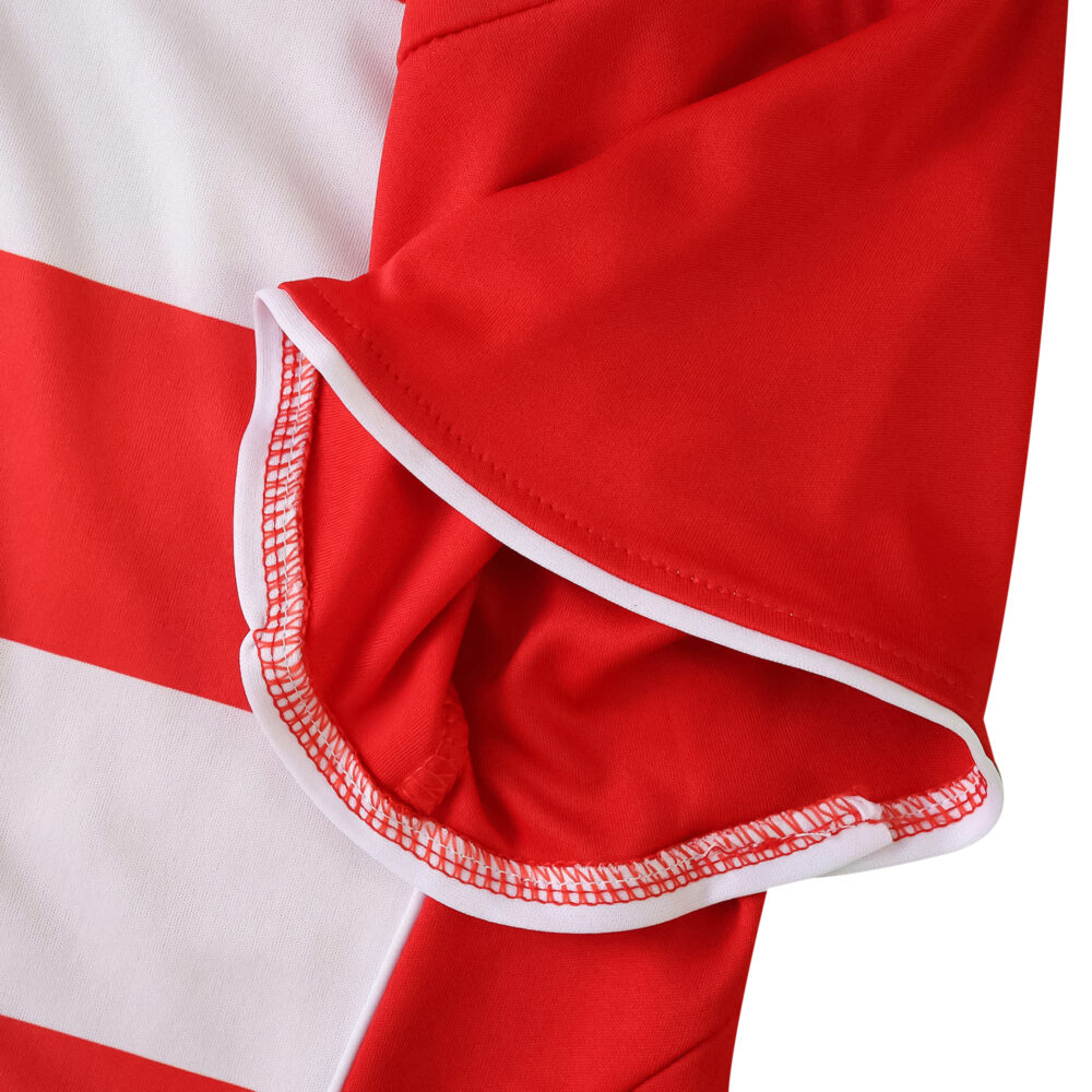Close-up of the sleeve on the Union Berlin Home 2025/26 Fan Version jersey, showing red and white details.