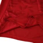 Close-up of the 2025/26 Valencia Away Fan Version jersey, showing red fabric with subtle geometric patterns.