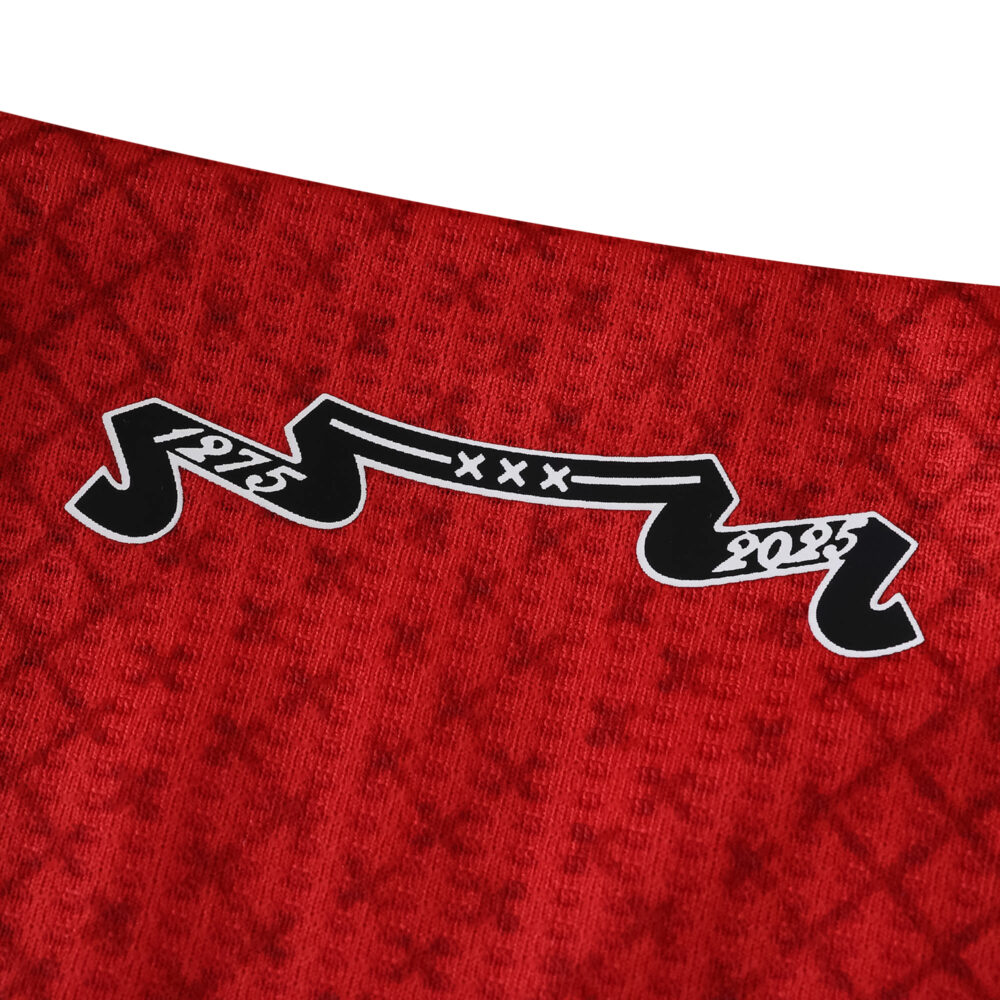 Close-up of the Ajax Home 2025/26 Player Version jersey featuring a black banner with "1975" and "2025".
