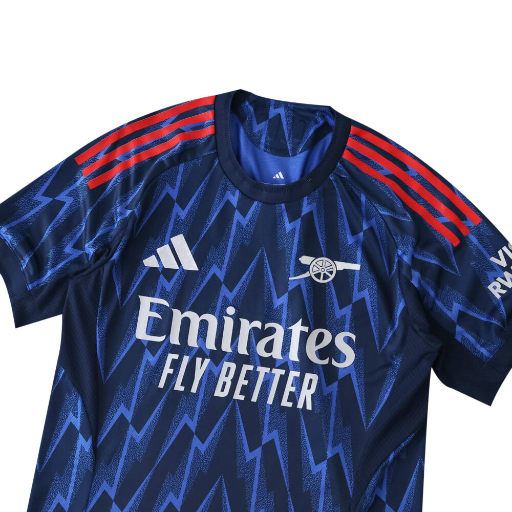 Arsenal Away 2025/26 Player Version jersey in navy blue with red stripes and zigzag pattern.