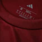 Close-up of the collar and size label on the Aston Villa Home 2025/26 Fan Version football shirt.
