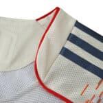 Close-up of Bayern Munich Away 2025/26 Player Version jersey collar with red trim and navy stripes.