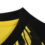 Close-up of the collar and fabric design on the Borussia Dortmund 2025/26 Home Fan Version jersey.