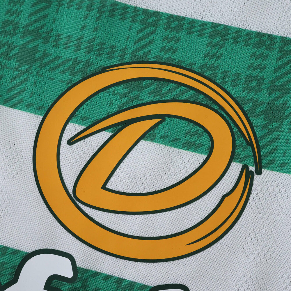 Close-up of the sponsor logo on the Celtic Home 2025/26 Player Version jersey, featuring green hoops.