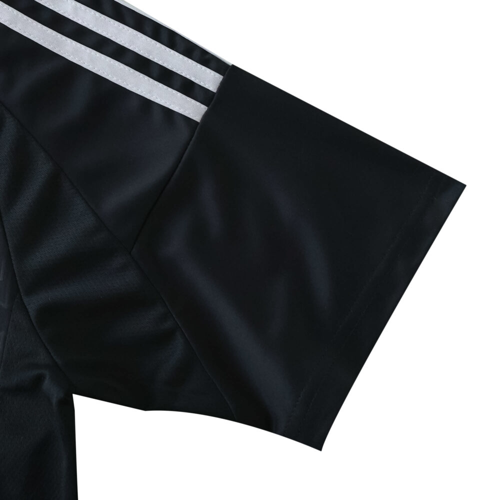 Close-up of the Charlotte FC Away 2025/26 fan jersey sleeve with white adidas stripes.