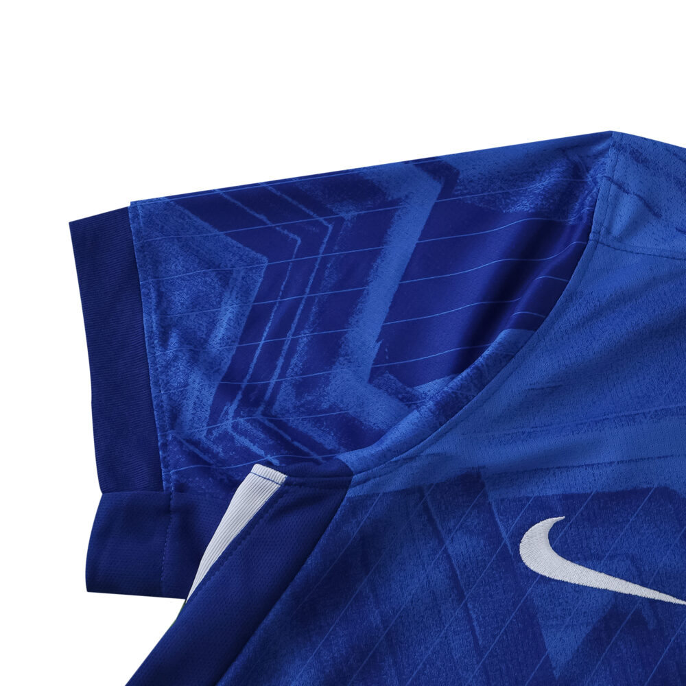 Close-up of the Chelsea Home 2025/26 Fan Version jersey sleeve with blue geometric patterns and Nike logo.