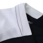 Close-up of the collar on the Corinthians Away 2025/26 Fan Version jersey, showing black and white detailing.