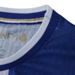Close-up of the FC Porto 2025/26 Player Version home jersey collar, showing blue and white details.