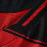 Close-up of Flamengo 2025/26 Home Player Version jersey showing red and black fabric details and stripes.