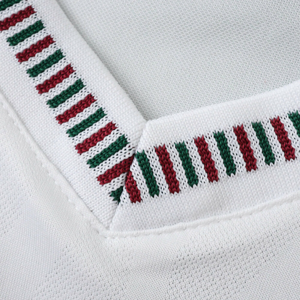 Close-up of the Fluminense Away 2025/26 Fan Version jersey collar with green and burgundy stripes.