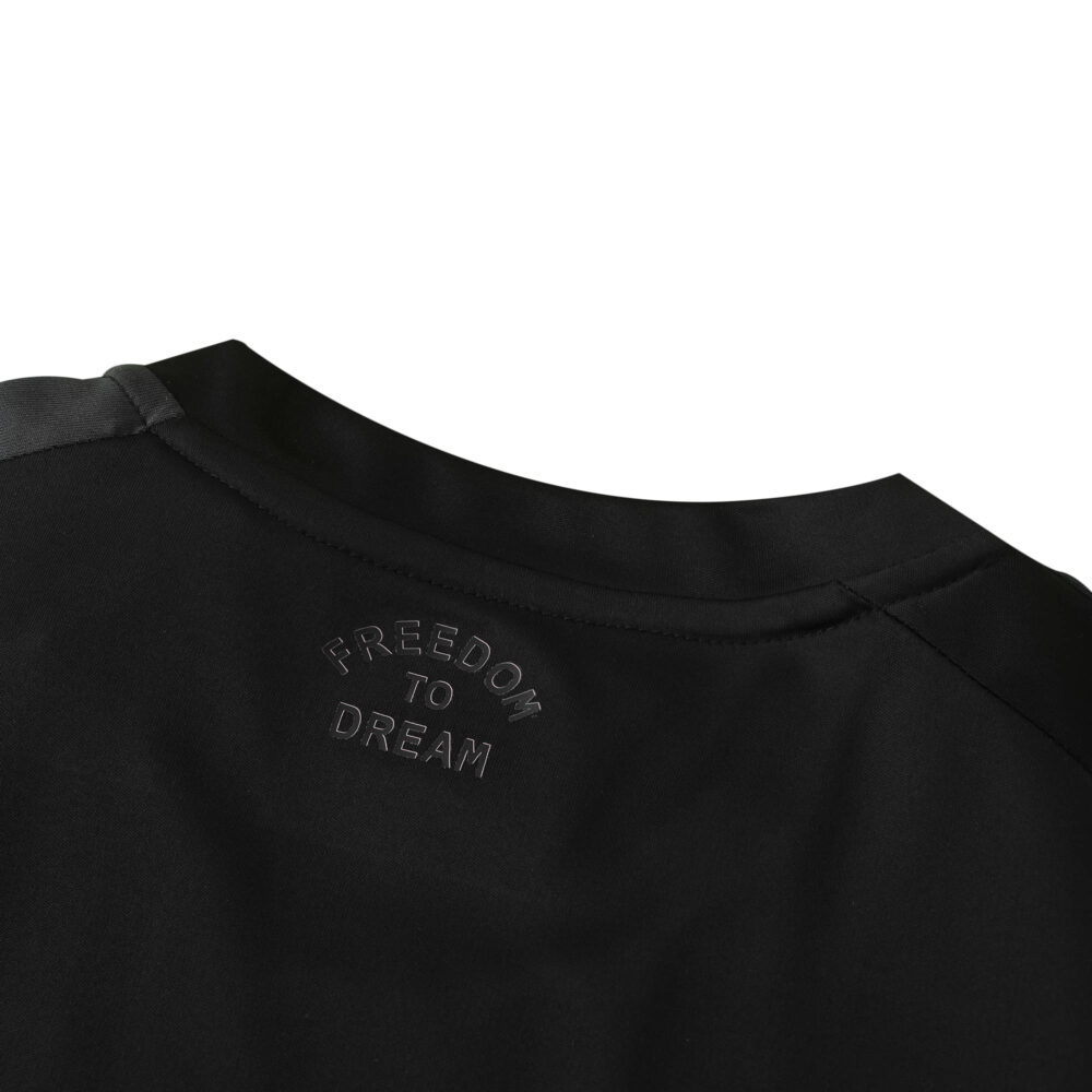 Close-up of the collar on the Inter Miami CF Away 2025/26 Fan Version jersey with "FREEDOM TO DREAM" text.