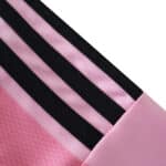 Close-up of the sleeve detail on the Inter Miami CF 2025/26 Home Fan Version jersey, featuring pink fabric and black stripes.