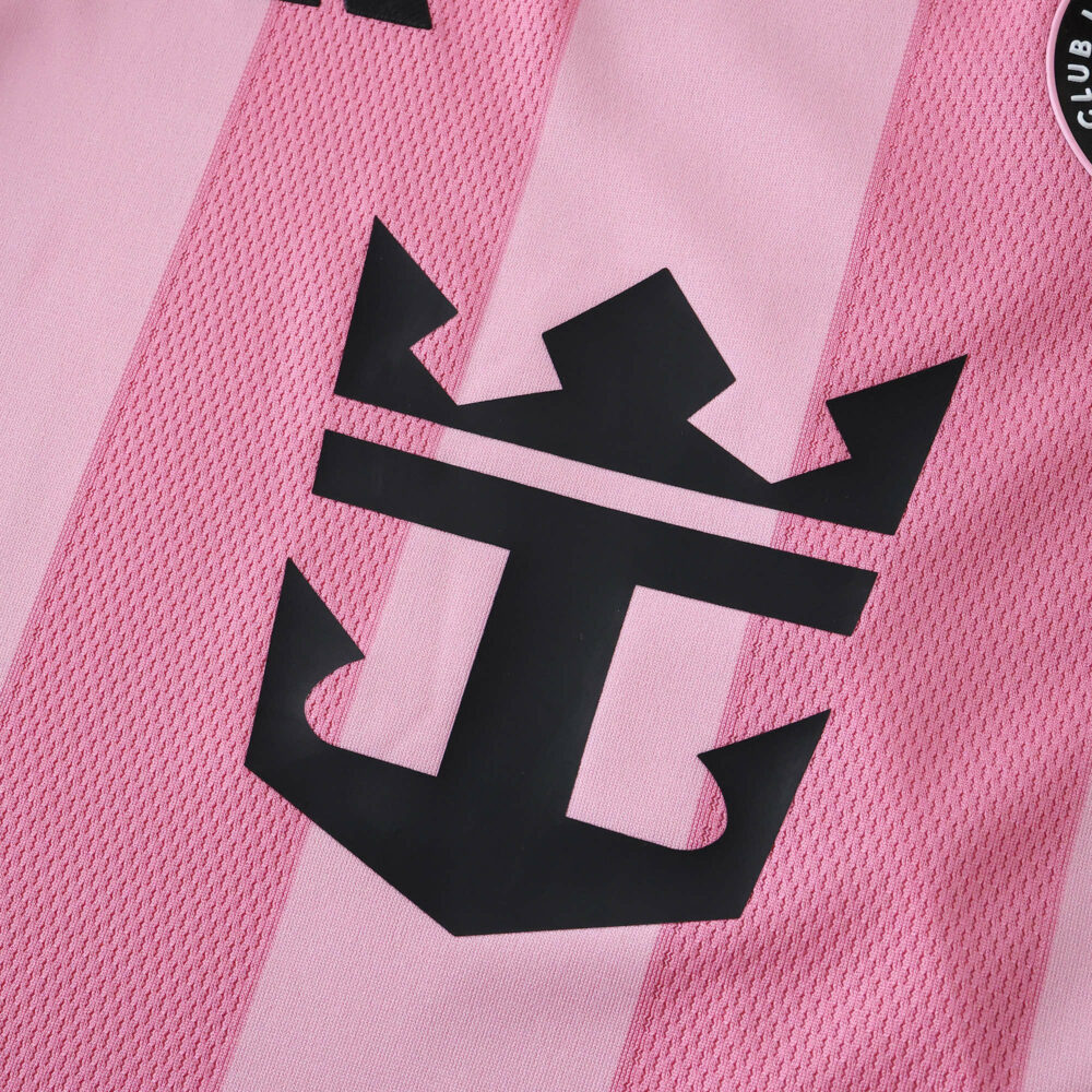 Close-up of the Inter Miami CF 2025/26 home player version jersey featuring a black crown anchor logo on pink fabric.