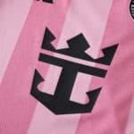 Close-up of the Inter Miami CF 2025/26 home player version jersey featuring a black crown anchor logo on pink fabric.